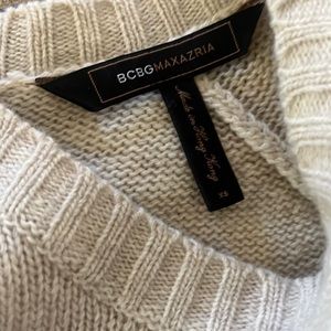 100% wool BCBG tan top with grey piping in back. Never worn